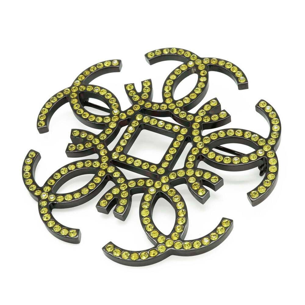 CHANEL Gold Logo Brooch
